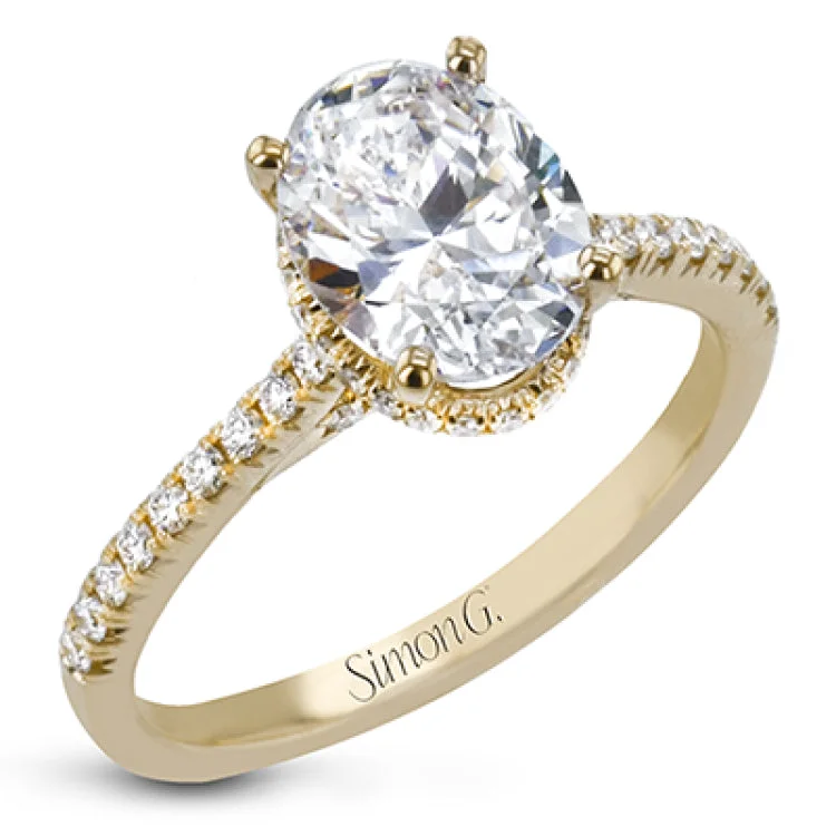 Women’s round diamond engagement rings-This 18k white gold engagement ring is perfect for an oval center stone, accented by .32 ctw of white diamonds.