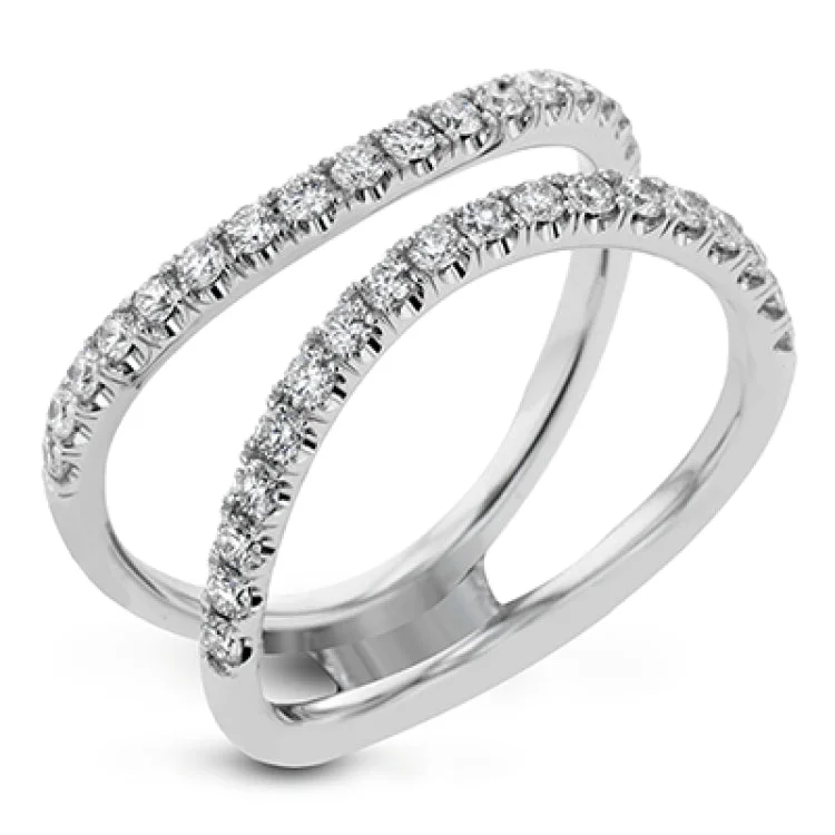 Women’s three-stone diamond engagement rings-This distinctive bridal set design features a double-layer wedding band that fits around the engagement ring. The set contains .77 ctw of white diamonds.