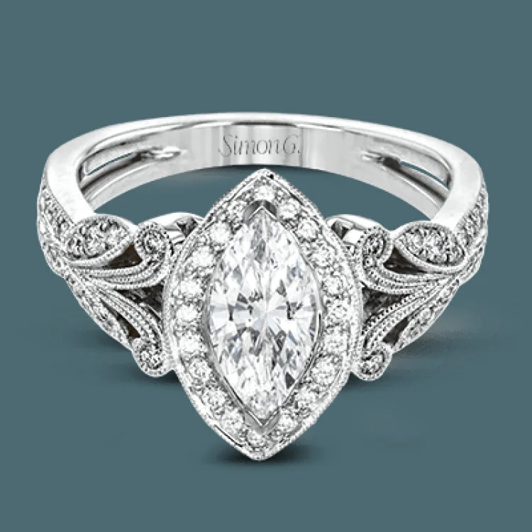 Women’s bridal engagement rings-This amazing 18k white gold engagement ring features vintage-inspired design elements set with .28 ctw of white diamonds.