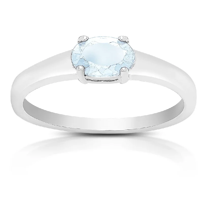 Women’s sparkling diamond rings-Dolce Giavonna Sterling Silver Blue Topaz Oval Solitaire Ring