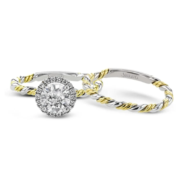 Women’s eternity diamond engagement rings-This ring is a twist on a halo engagement ring, with 18k yellow and white gold intertwining in the band.