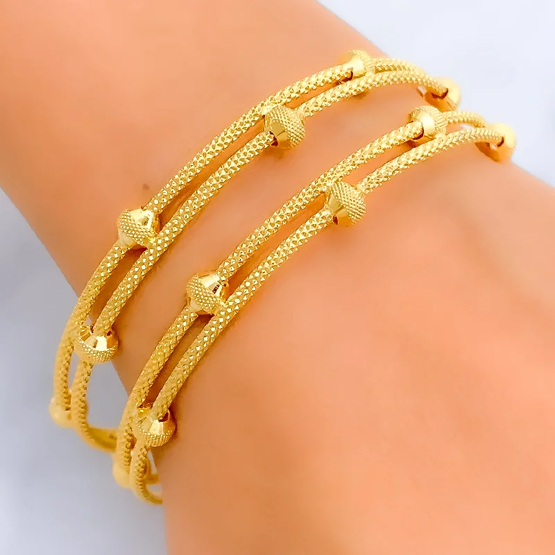 Women’s engraved charm bracelets-Couture Captivating 22k Gold Bangle Pair