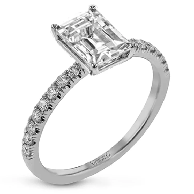 Women’s minimalist engagement rings-This distinctive bridal set design features a double-layer wedding band that fits around the engagement ring. The set contains .77 ctw of white diamonds.