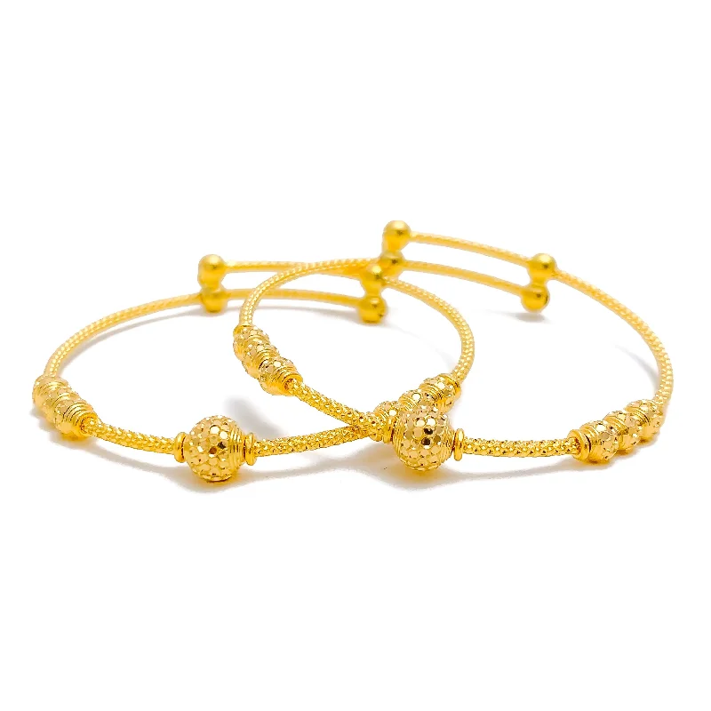 Women’s diamond tennis bracelets-Dazzling Disco Orb 22k Gold Baby Bangle Pair