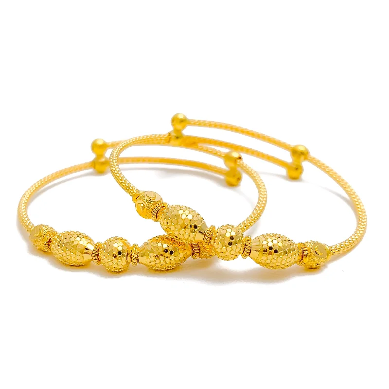 Women’s birthstone bracelets-Shimmery Elongated Orb 22k Gold Baby Bangle Pair