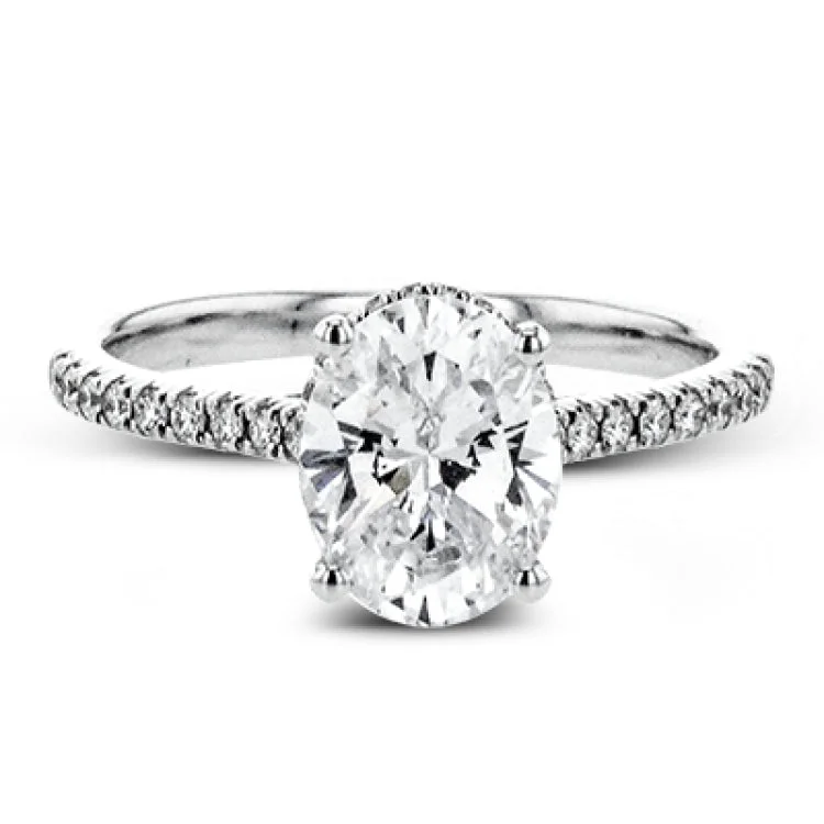 Women’s affordable diamond engagement rings-This 18k white gold engagement ring is perfect for an oval center stone, accented by .32 ctw of white diamonds.