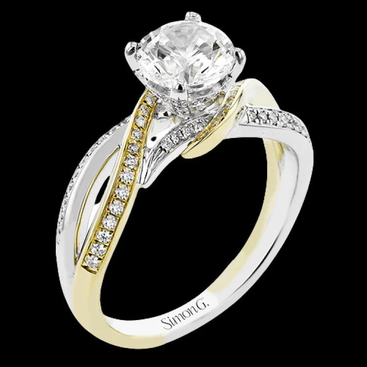 Women’s stackable engagement rings-This 18K two-tone engagement ring wraps your finger in twistes bands of white and yellow gold accented with 0.26 ctw. of diamonds